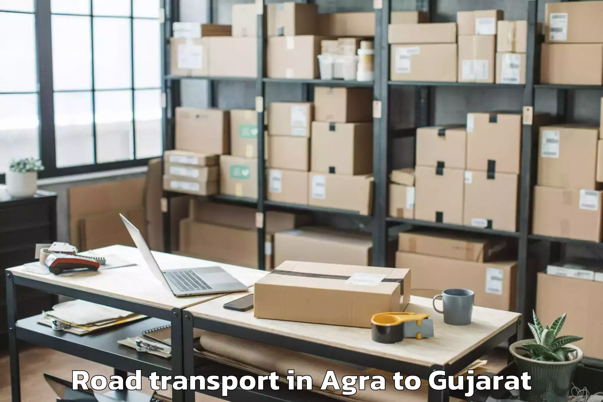 Book Agra to Songadh Road Transport Online